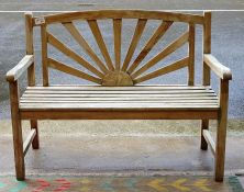 Pair of teak garden benches with 'sunburst'  backs 120 cms w.