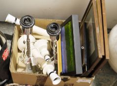 Large white ceramic urn with bow detail, a pair of metal table lamps on glass bases, various prints,