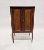 Lidstone mahogany music cabinet labelled to inside cupboard door, on tapering supports, 91cm high