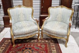 Pair Louis XV revival giltwood armchairs, each with shaped top rail centred by pair of flowers,