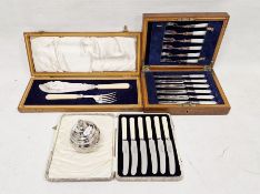 Set of six pairs of EPNS and mother-of-pearl handled fruit knives and forks, engraved blades, in oak