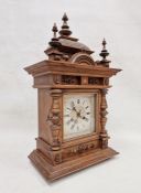 19th century oak cased Black Forest-style mantel clock, carved and moulded case with urn finials and
