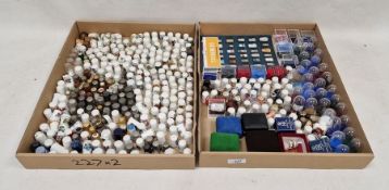 Large collection of ceramic and metal souvenir and commemorative thimbles and empty thimble domes