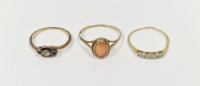 9ct gold and coral oval set ring, a gold-coloured metal and five-stone ring and a gold (band