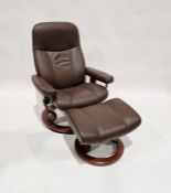 Brown leatherette reclining and revolving easy armchair with footstool