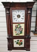 American wall clock of rectangular form with three glazed panels, two decorated with fruit and