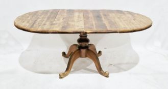 Stained pine oval extending dining table, 76cm high x 180cm long (unextended) x 105cm wide