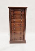 Early 20th century stained wood Wellington chest comprising of eight drawers, on plinth base,