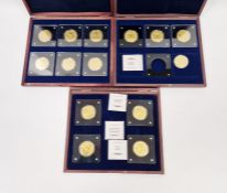 Collection of 1/200oz Windsor Mint gold coins, housed in three wooden display boxes, to include