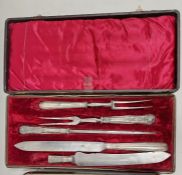 Cased Victorian silver-handled carving set, three pieces, crested handles (one handle broken),