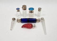 Silver-topped cut glass salts bottle with blue guilloche enamel top, another smaller with lilac