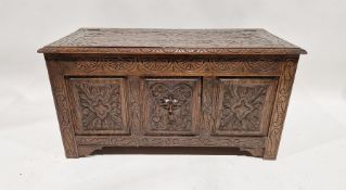 Carved oak chest with panelled carved front, relief mask, 50cm high x 98.5cm wide Condition