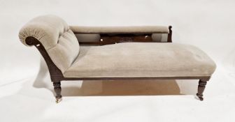 Late Victorian stained oak scroll end day bed with partly button upholstered back, on turned stump