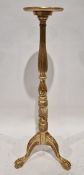 Gilt torchere stand on scroll supports