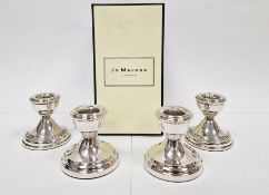 Pair of silver-filled squat candlesticks, Birmingham 1990, 6.5cm high and a pair of 1970's silver-