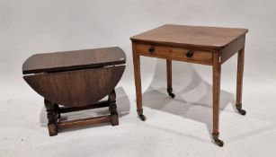 20th century oak side table with frieze drawer, on square supports and castors, brass escutcheon,