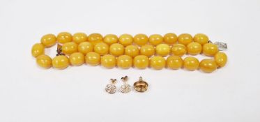 Butterscotch amber necklace with silver clasp, a pair of gold-coloured stud earrings with Chinese