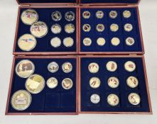 Collection of commemorative coins, in seven wooden cases, to include Winston Churchill copper gold