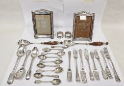 Pair of silver-mounted photograph frames, a quantity of plated flatware, a pair of silver napkin
