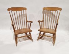 Pair modern stickback rocking chairs, each with curved overset shoulderboard (2)
