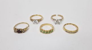 Five assorted silver gilt and gem set rings