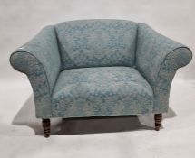 Blue and grey arabesque weave upholstered small settee with outscroll arms, on turned stump