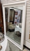 Massive white painted wood rectangular wall mirror with cavetto moulded frame, bevelled glass plate,