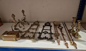 Pair of brass fire dogs, candlesticks and assorted metalware