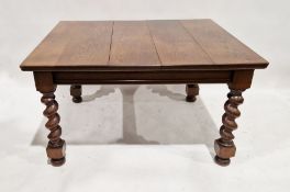 Oak extending dining table, rectangular, on heavy spirally twisted supports and bun feet, 107cm x