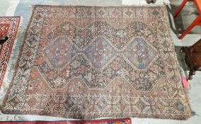 Eastern midnight blue ground rug with three hexagonal medallions on a geometric shaped field,