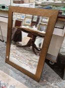 Modern wooden framed mirror with brushed bronze effect and bevelled plate, 89cm x 64cm