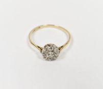 18ct gold and diamond cluster ring, the central circular diamond surrounded by eight smaller