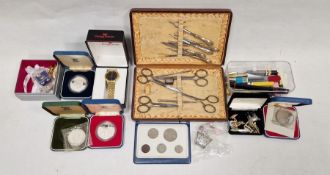 Silver-handled cased manicure set in fitted box, various coins, a small quantity of costume