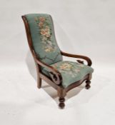 Victorian mahogany open armchair with padded back and stuffover seat in floral woolwork tapestry,