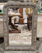 Painted wood rectangular wall mirror with round arch top, the frame all embossed with trailing