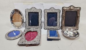 Pair of 1980's silver-mounted picture frames, floral repousse decorated, Sheffield 1985, 19cm high x