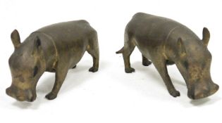 Pair probably African patinated metal models of wart-hogs, 15.5 cm long