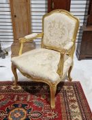Louis XV revival giltwood open armchair with pair flowers to the top rail, cartouche-shaped back and