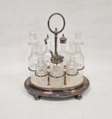 19th century silver plated condiment set on original fitted stand, comprising four cut glass bottles