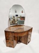 1930's/40's walnut wood dressing table of eliptical shape and an arrangement of seven drawers around