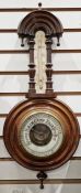 Small Victorian banjo barometer with arched top decoration with drop ball finials, visible aneroid