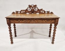 19th century carved oak revived Renaissance-style side table with raised and carved back of fruiting