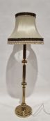 Modern brass standard lamp, of ribbed cylindrical form with interspersed sphere's, approximately