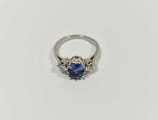 White metal, diamond and blue stone dress ring set central oval blue stone, possibly tanzanite,