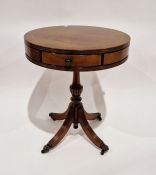 Reproduction mahogany drum-top occasional table with three drawers, raised over a quatrefoil base