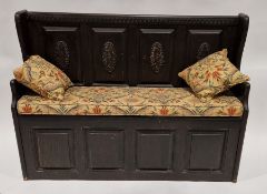 20th century stained pine monk's bench with carved oval floral motifs to the back panel, 88cm high x
