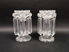 Pair of Victorian clear cut glass lustres with petal-shaped rims suspending prism cut drops, on