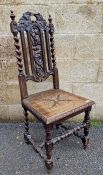Late 19th century oak hall chair, the back carved with ornate leaf and foliate decoration, with