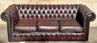 20th century three-seater leatherette upholstered Chesterfield sofa, 194cm long