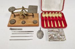 Early 20th century set of postal scales with weights, a cased set of six gilt teaspoons, a mother-